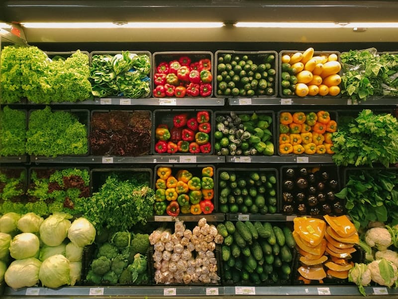 Bustling Italian marketplace with fresh produce and artisanal goods on display