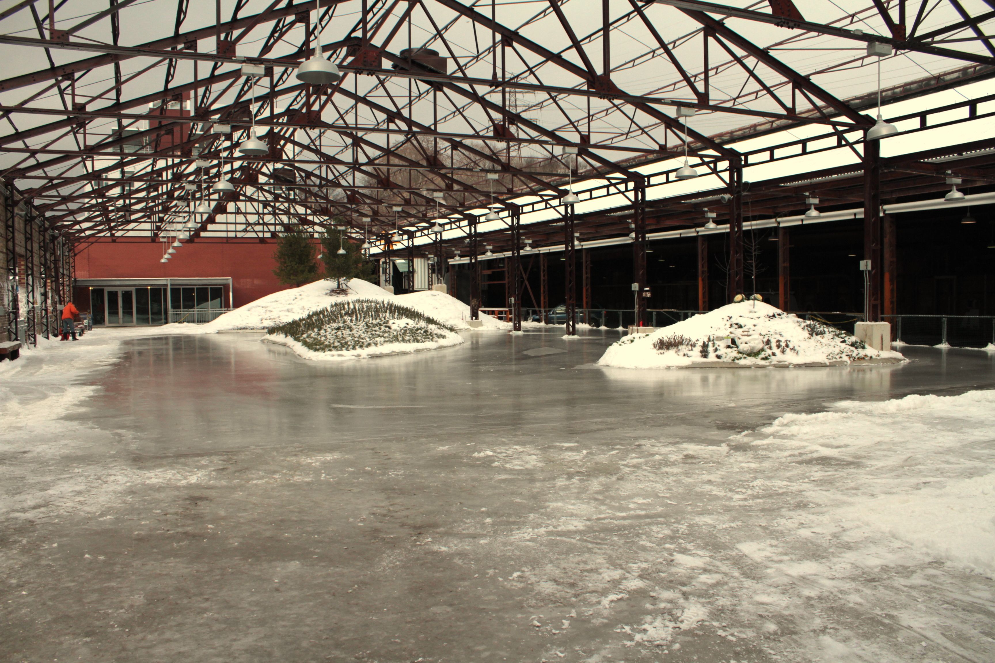Evergreen Brick Works outdoor skating rink under factory beams