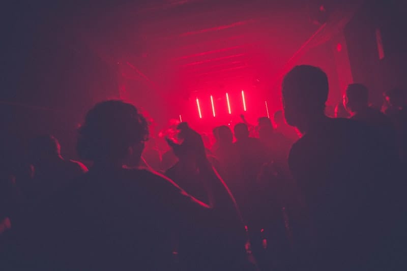 Modern nightclub with neon lights and energetic crowd