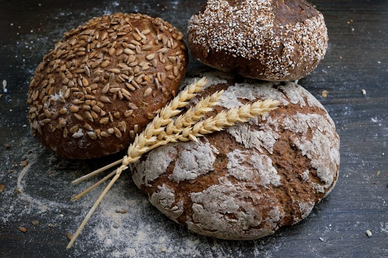 Artisan sourdough loaves and French pastries on bakery display
