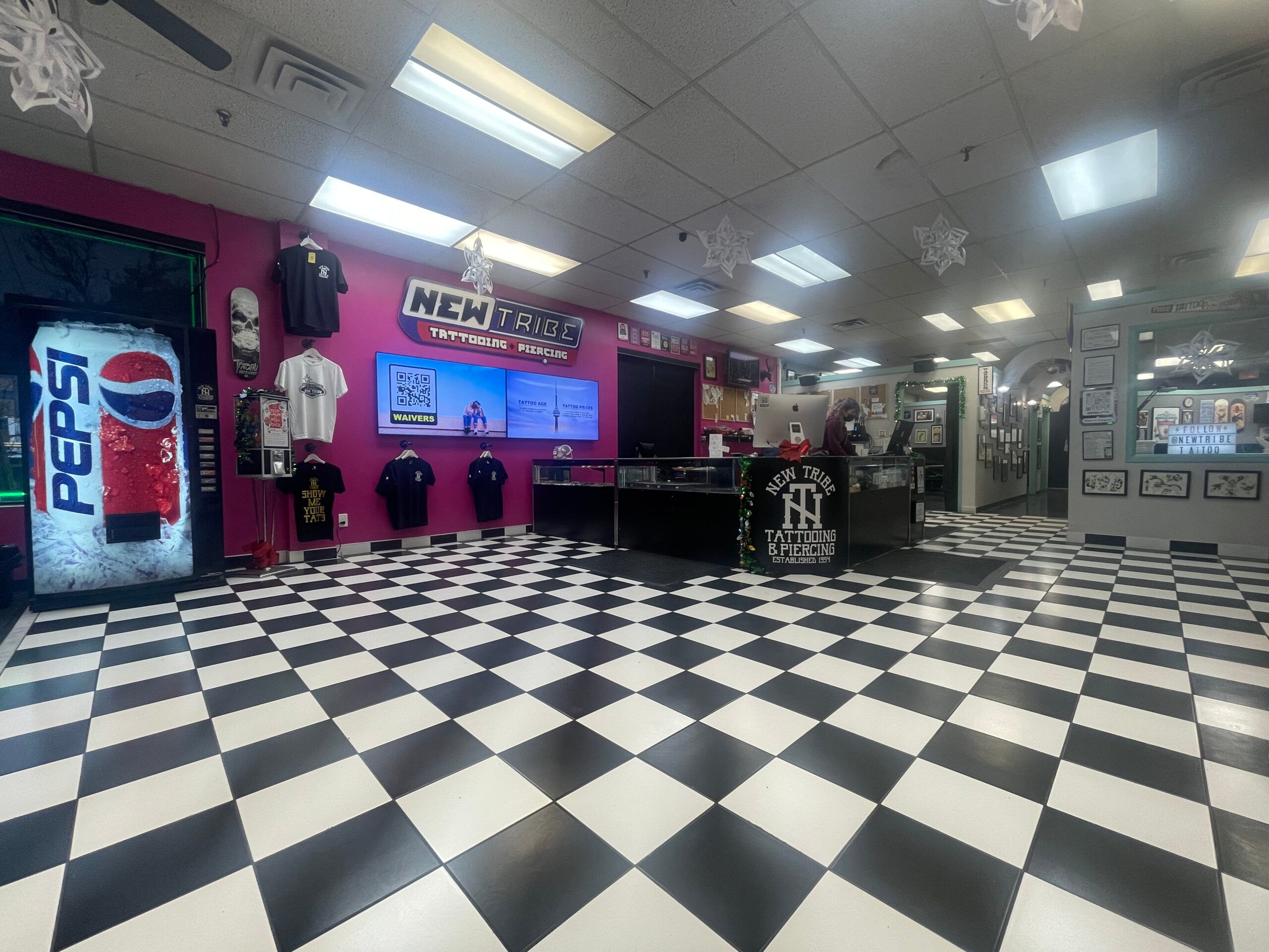 Inside New Tribe Tattoo + Piercing on Queen Street West