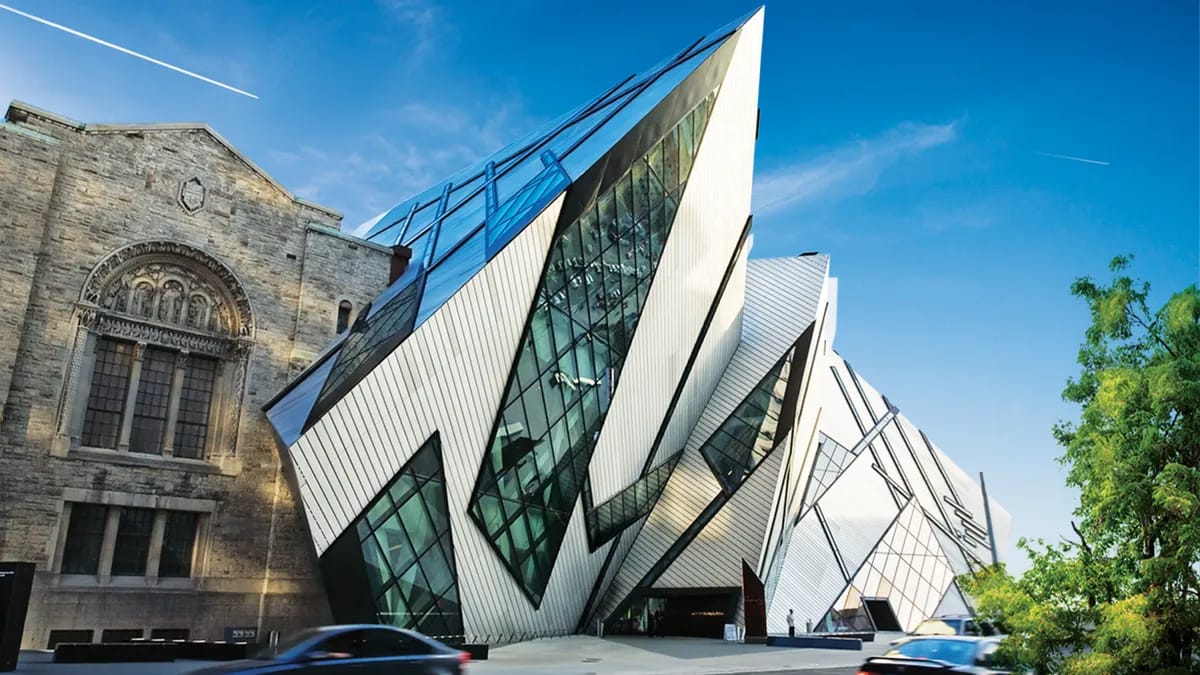 The Royal Ontario Museum exterior showing the historic stone building and the modern Michael Lee-Chin Crystal addition.