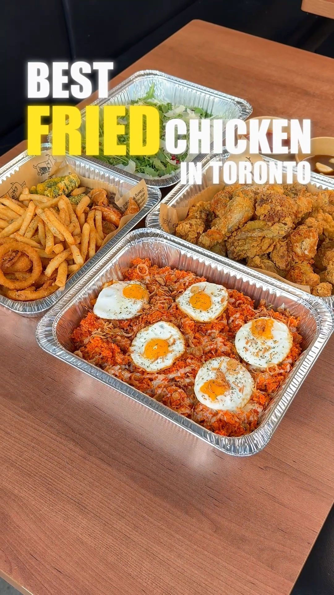A platter of Korean fried chicken with various sides at Sarang Kitchen.