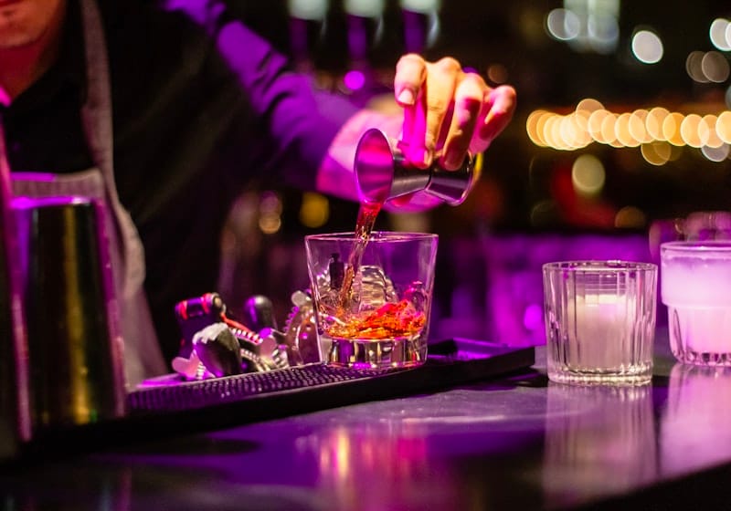 Vibrant nightclub interior with dramatic lighting and dance floor