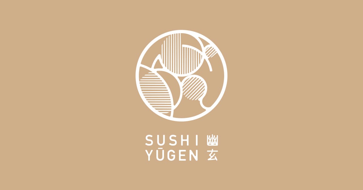 The intimate eight-seat chef's counter at Sushi Yugen featuring minimalist light oak decor.
