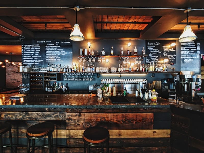 Cozy neighbourhood pub interior with warm wood tones and vintage decor