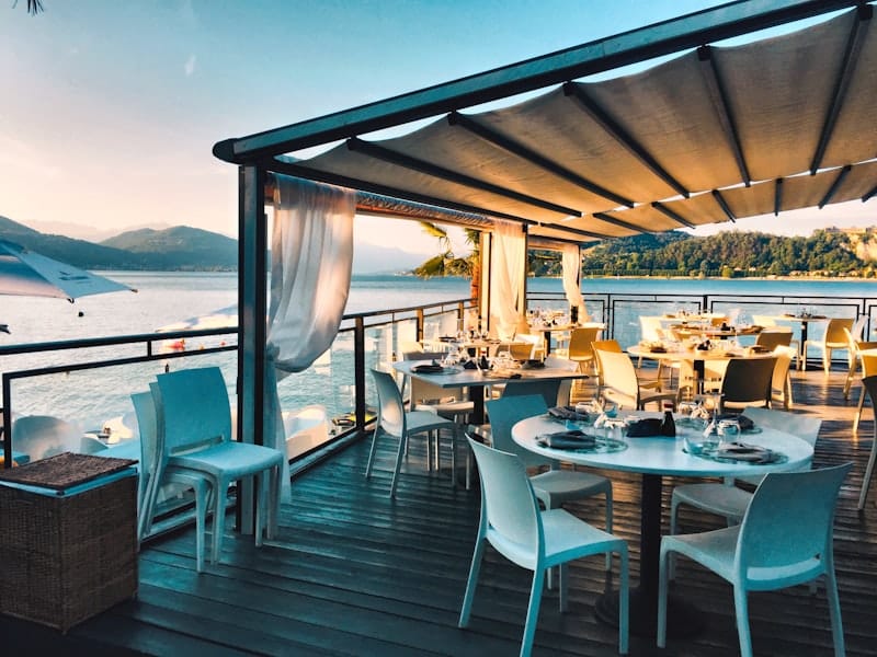 Elegant rooftop restaurant with city skyline views and warm lighting